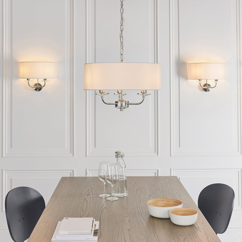 Endon Nixon Twin Arm Bright Nickel Finish Wall Light - Lifestyle image, with matching ceiling Light above Dining Room Table