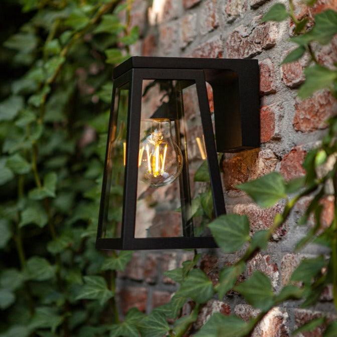 Lutec Fia Solar Outdoor Wall Light - Matt Black 6990901012 fixed to an outside wall