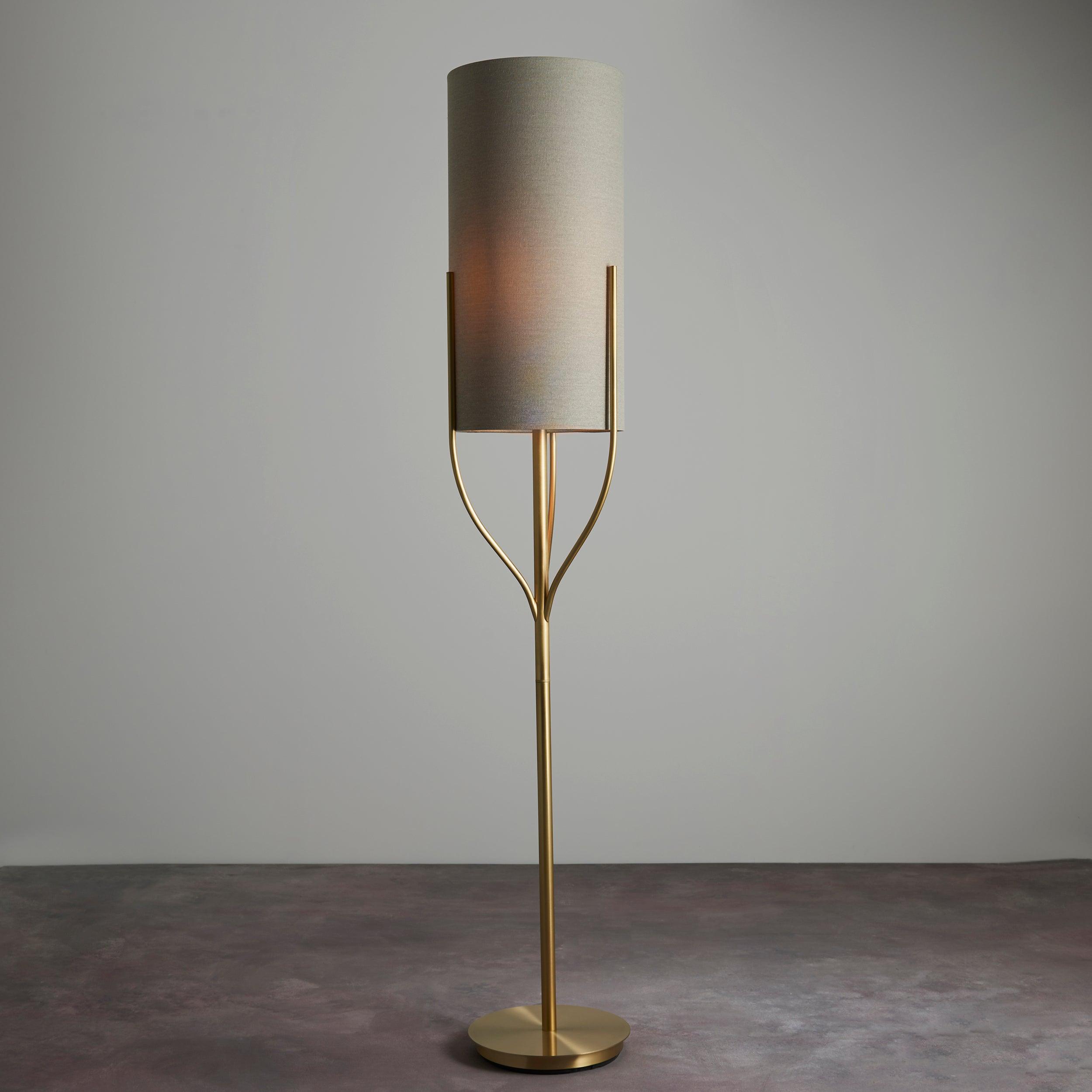 fraser brass floor lamp with natural linen shade by Endon Lighting Living room close up image