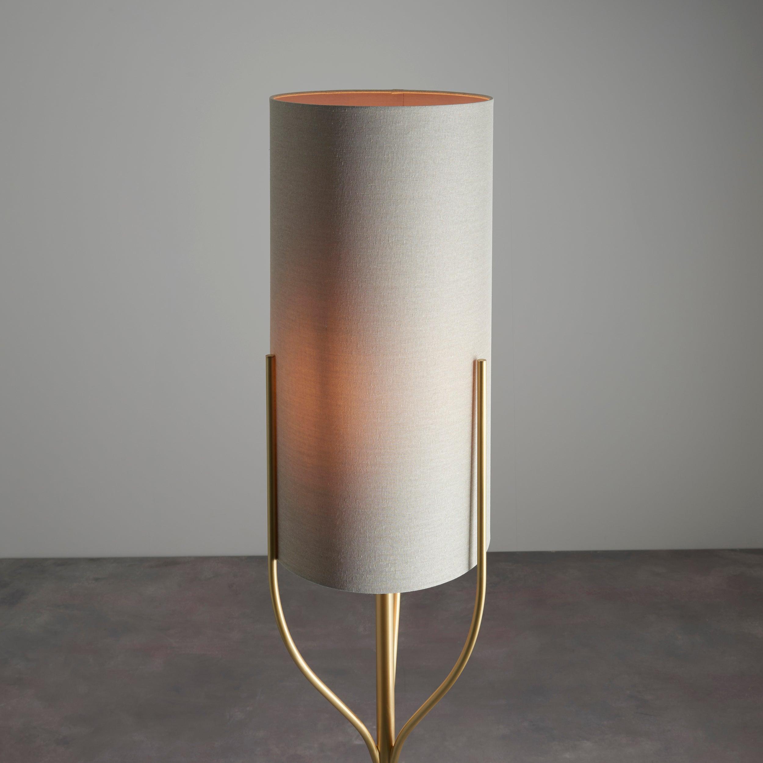 fraser brass floor lamp with natural linen shade by Endon Lighting Living Room Family Shot